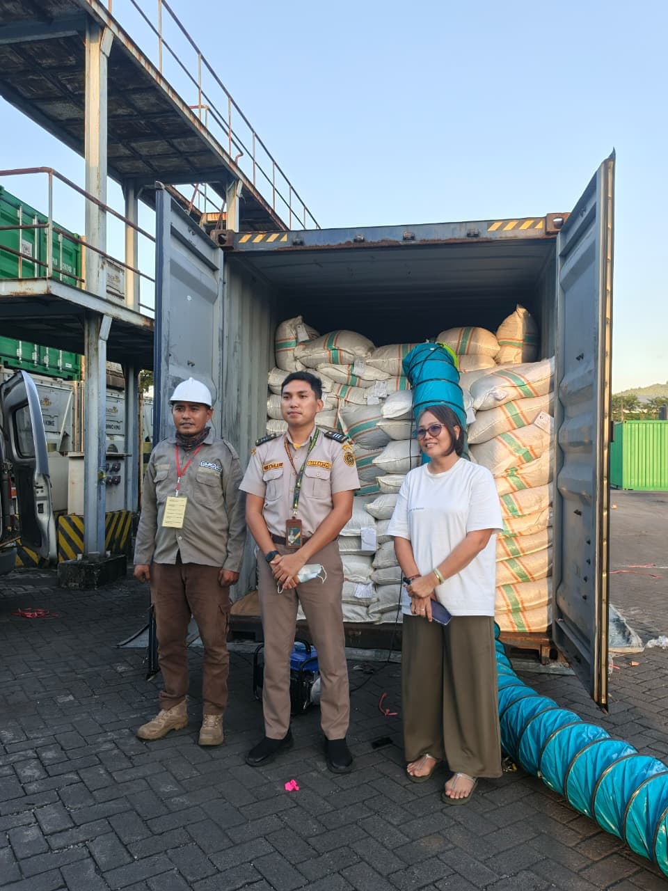 Quarantine officer and team inspecting loaded export container at Indonesian port